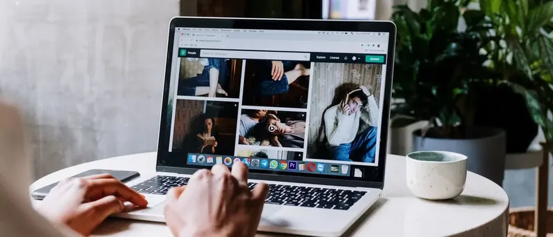 Laptop showing a Google Ads Data Studio report with spend, conversions and campaign performance